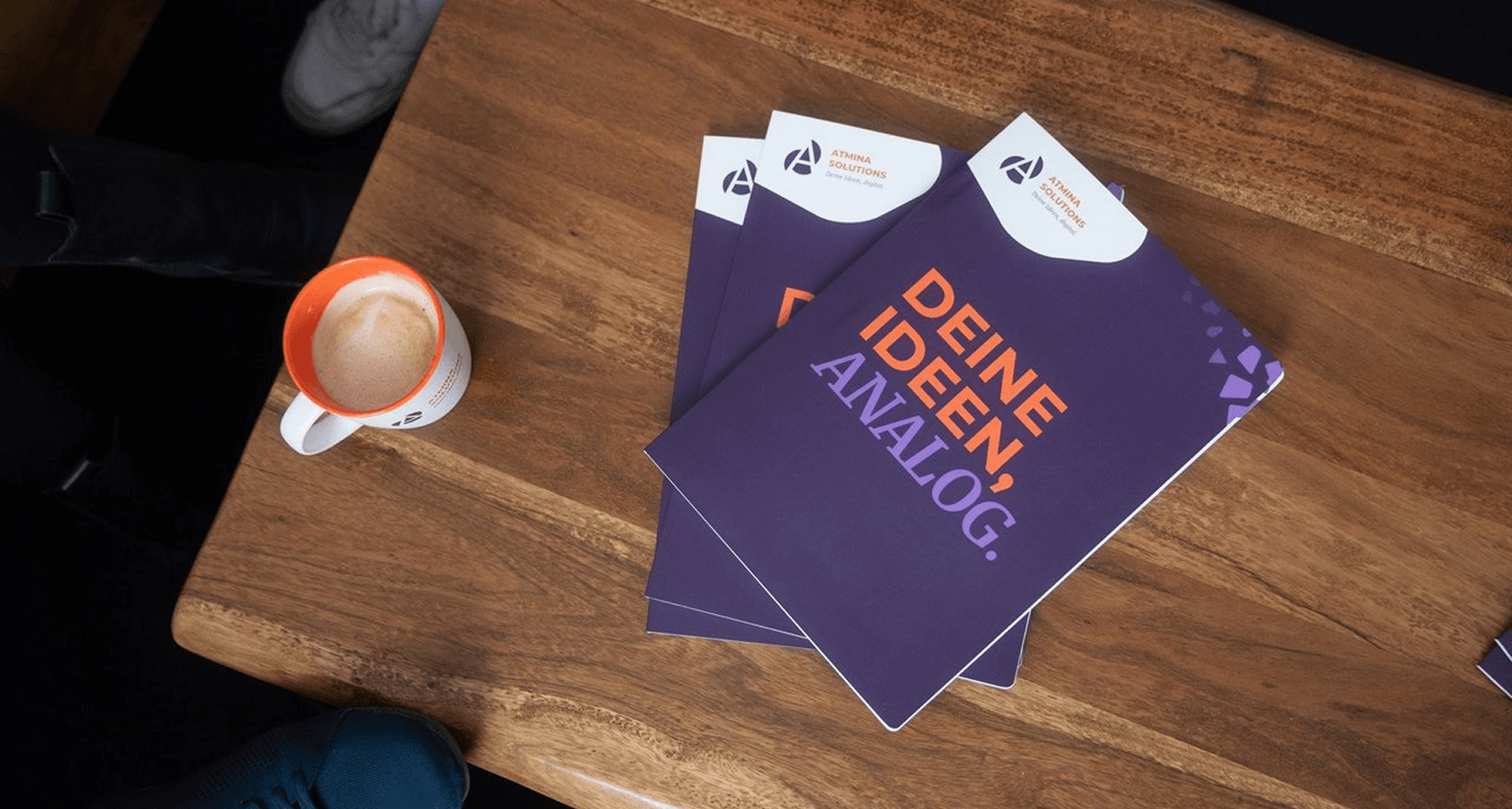 A cup of coffee and note pads